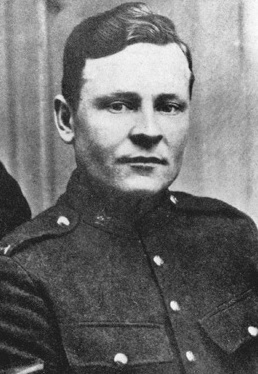 A black-and-white photograph of a soldier.