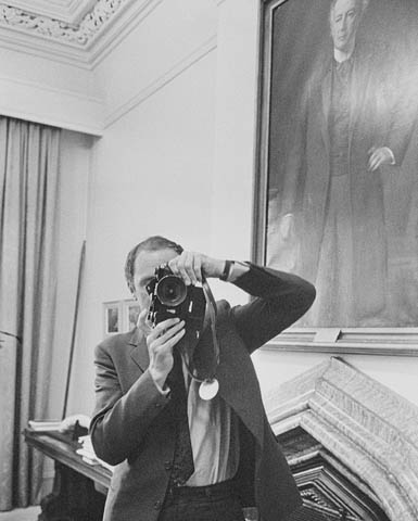 Black-and-white photograph of Prime Minister Pierre Elliott Trudeau taking a photograph