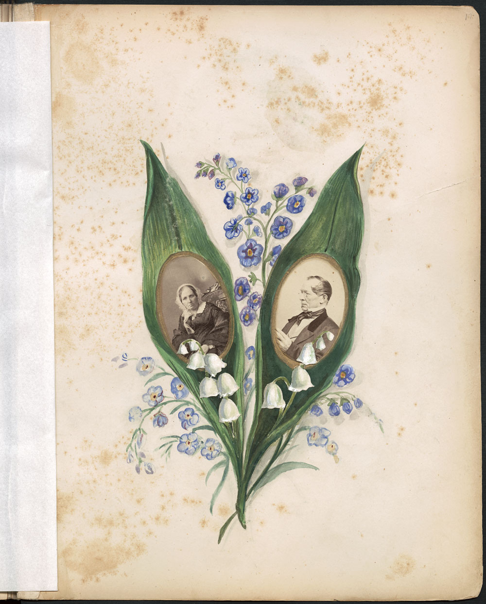 An album page with photographs of a man and a woman in the middle of two green leaves and surrounded by purple flowers. 
